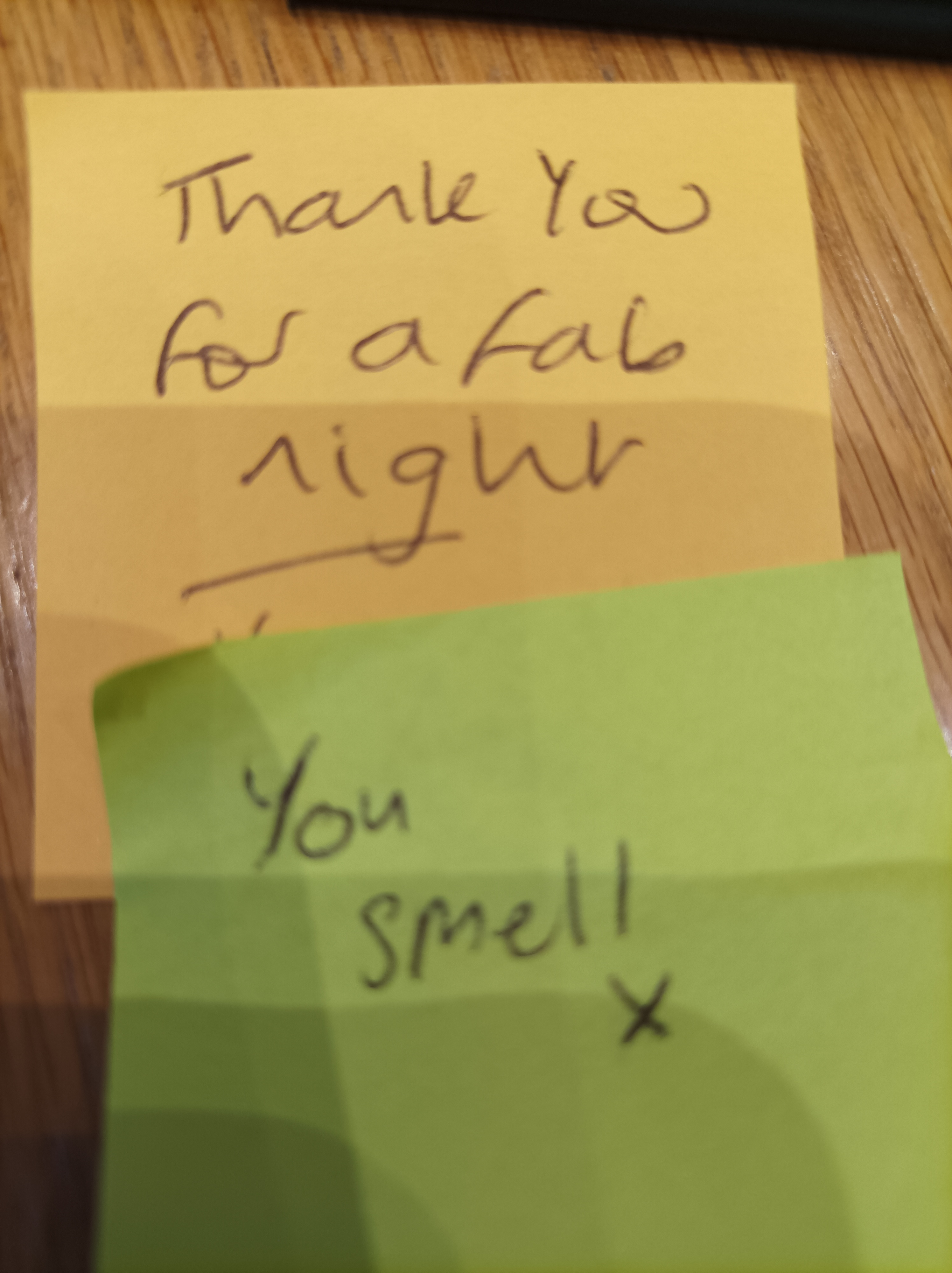 Two post-it notes one that reads "thank you for a fab night", the other "you smell x"